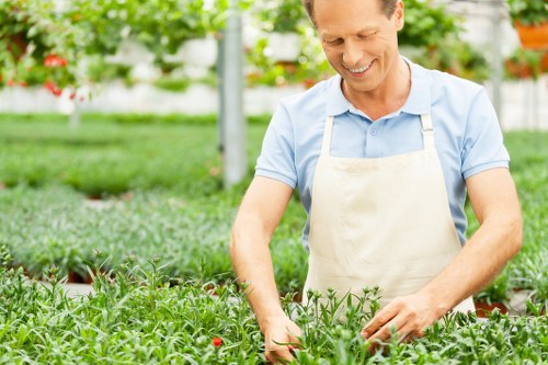 Worker using protective gear during garden care tasks